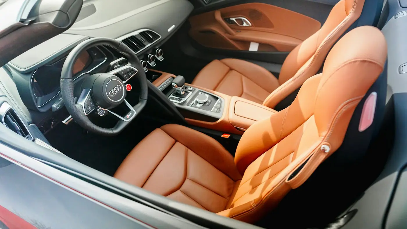 Quilted leather rear cabin of a chauffeured sedan